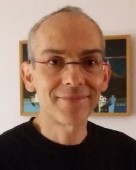 A person wearing glasses Description automatically generated with medium confidence