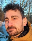 A person taking a selfie Description automatically generated