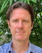 A person in a blue shirt Description automatically generated with low confidence